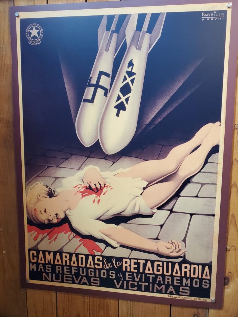 Spanish civil war Republican poster, 1936 "Comrades of the rear guard. More shelters and we will avoid new victims"