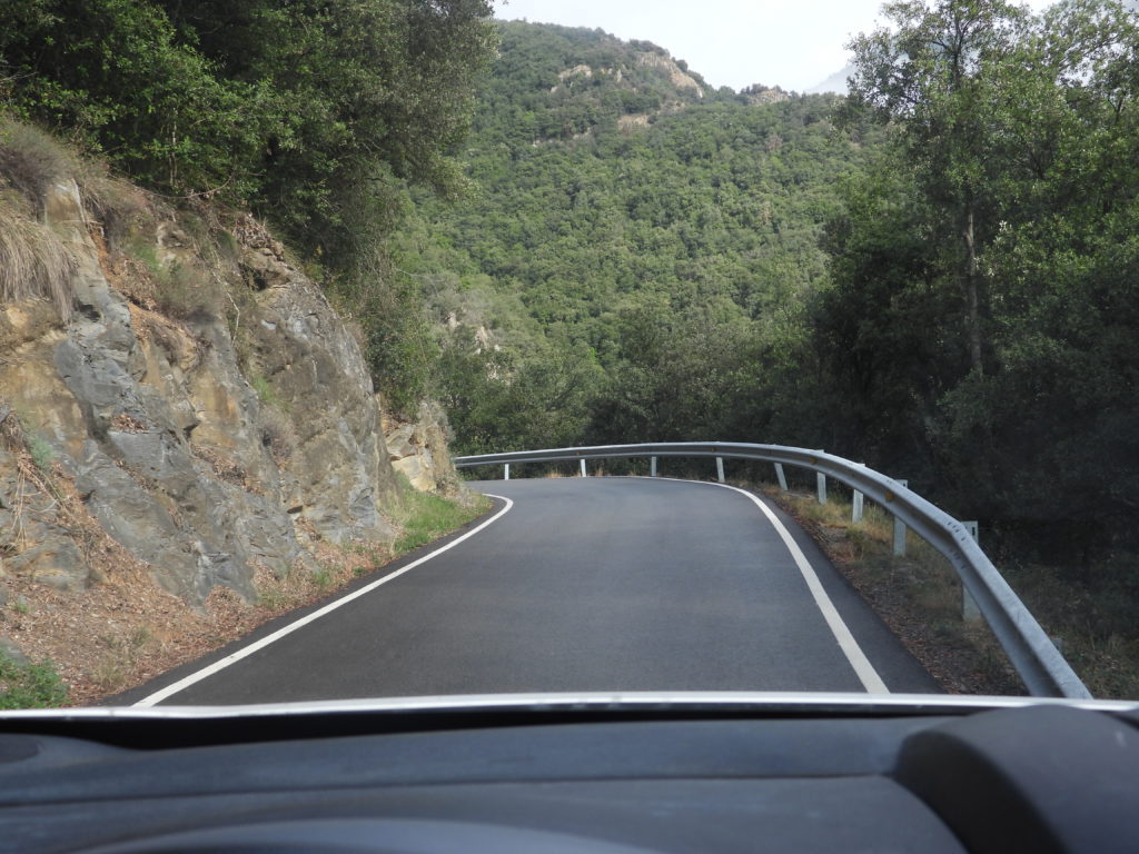 Two way mountain road. This isn't the best example of the extreme pavement because, at the extremes, I don't dare to stop to take photos.