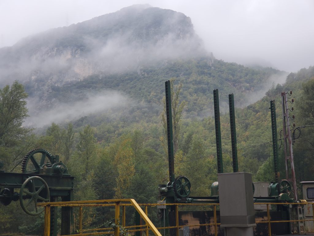 The village is somewhere up there in the rain and clouds. Flow control gates are in the foreground.