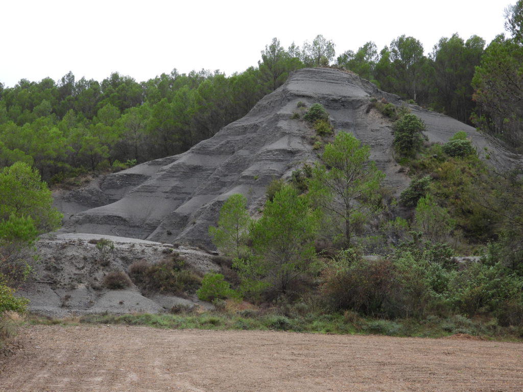 Gravel or solid rock? There are several hills like it.