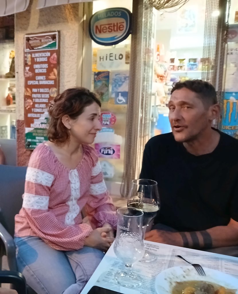 My host. Nika. left, at the bar
