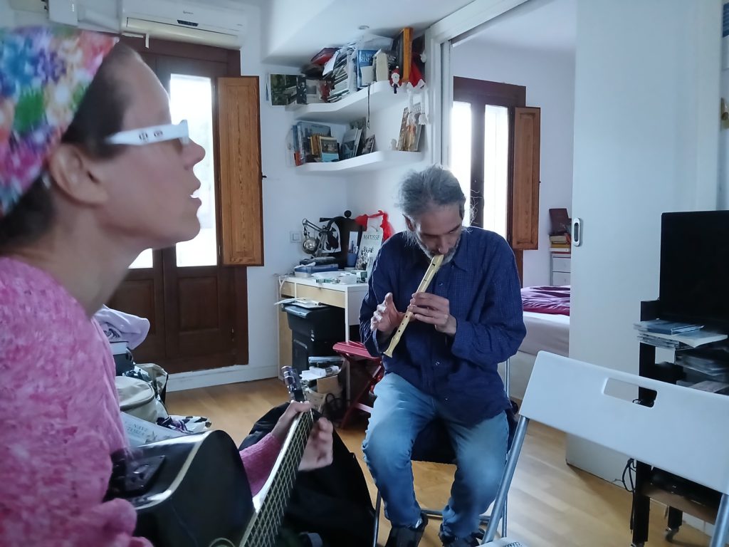 Sophia singing and playing, Abel accompanying on the flute.