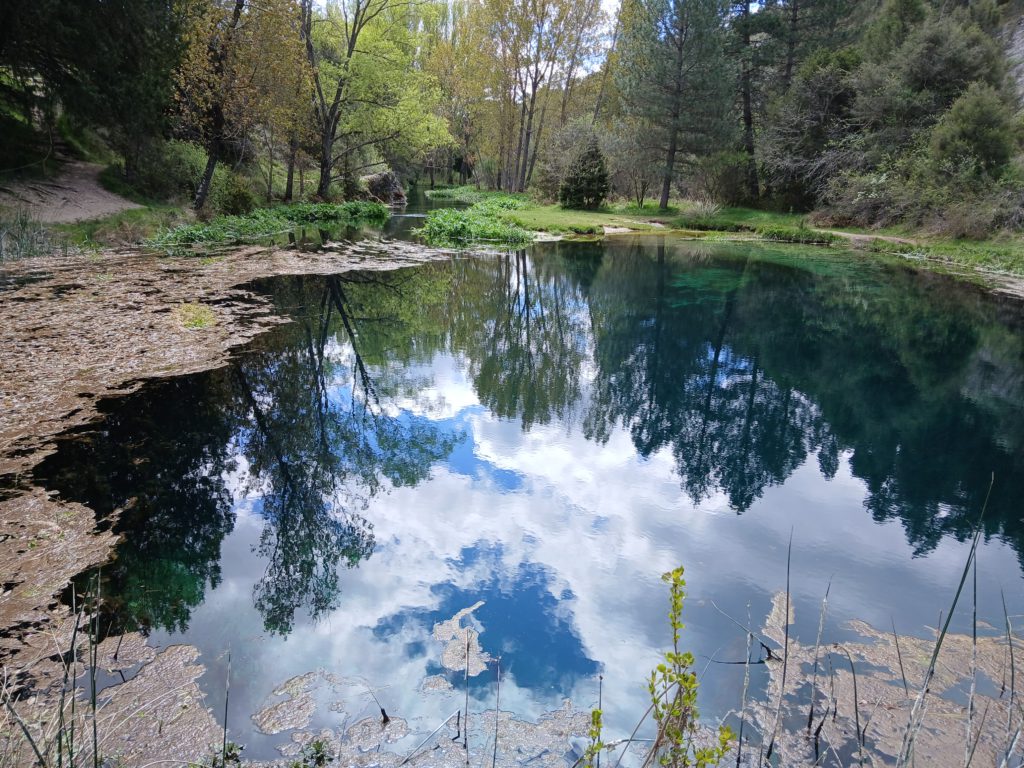 The pond where the spring flows upward from the cave system