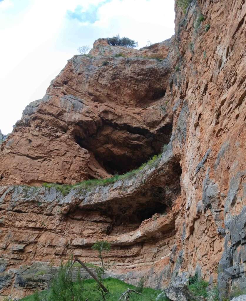 Struggling along the cliff/talus margin. No way to ascend the cliff itself.