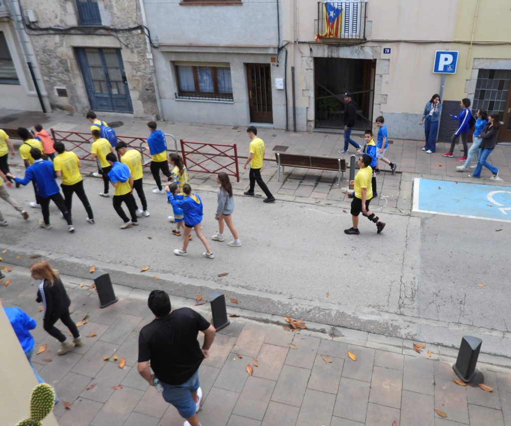 Handball team and celebrating fans passing Eric's house