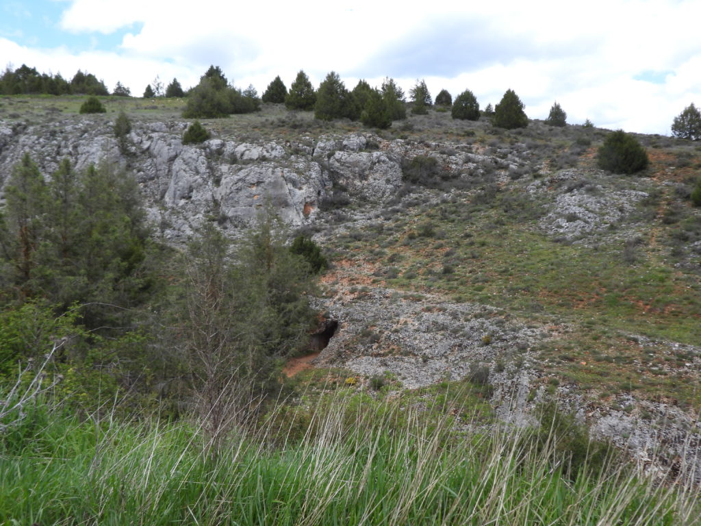 The rock ridge through with tunnel exit