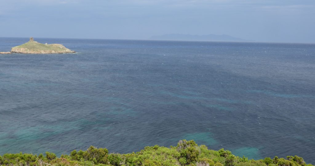 Genoese watchtower on Finocchiarola Island. That's Elba, Napoleon's exile island in the hazy distance.